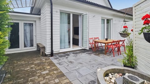 Spacious private terrace with outdoor dining and direct access from the living room and bedrooms.