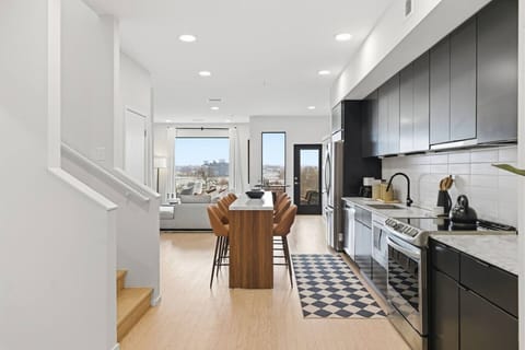 Fully equipped, modern kitchen for all of your cooking needs! Has a kitchen island with dining seating for 8.