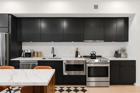 Fully equipped, modern kitchen for all of your cooking needs! Has a kitchen island with dining seating for 8.