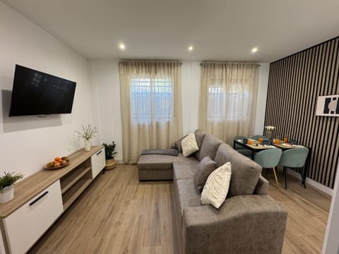 Comfort Apartment, Patio | Living area | 40-inch LED TV with digital channels