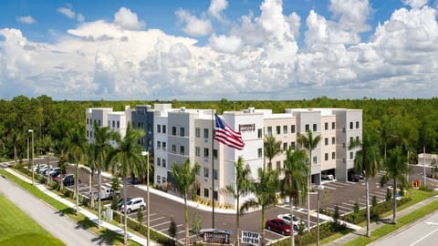 Discover modern elegance with a sleek exterior and inviting landscaping that welcomes you.