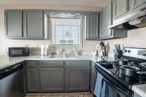 The lighting from the kitchen window invites warmth into the space and allows for a more natural start to the day.