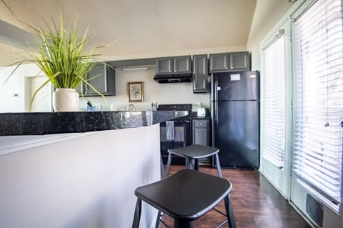 The bar area stretches all the way around to the laundry area through the kitchen, making counter-space a great amenity of this place.