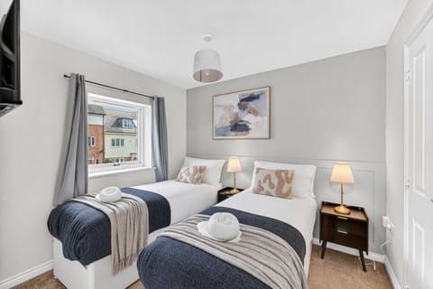 The master bedroom features a comfortable zip-and-link bed, arranged as two single beds by default, with the option to convert it into a king upon request.
