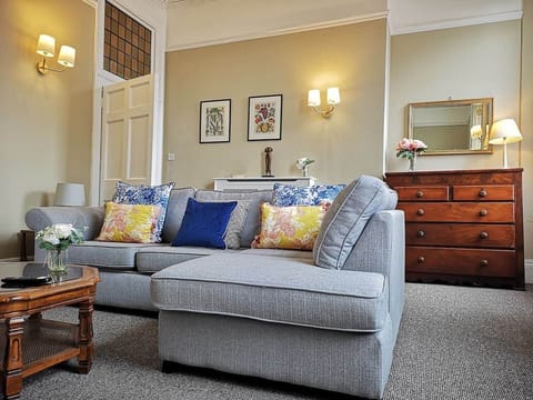 Living room . This grey sofa turns into a double sofa bed.