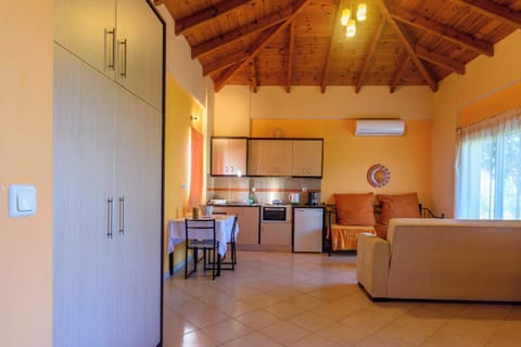 Living Room with Sofa, Dining Area, and Natural Light