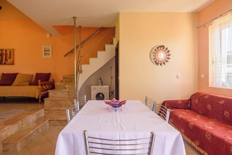 Dining Area with Staircase and Open Living Space