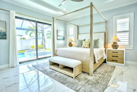 Master Bedroom with King Bed, Fan, and Flat Screen TV; Private Entrance to the Pool Area!