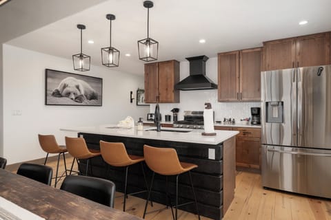 Cook and connect in this stunning modern kitchen featuring sleek appliances, spacious quartz countertops, and stylish seating for memorable meals together.