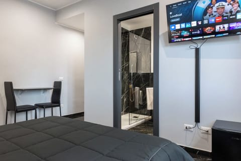 Deluxe Triple Room, 1 King Bed with Sofa bed, Private Bathroom | In-room safe, desk, laptop workspace, blackout drapes