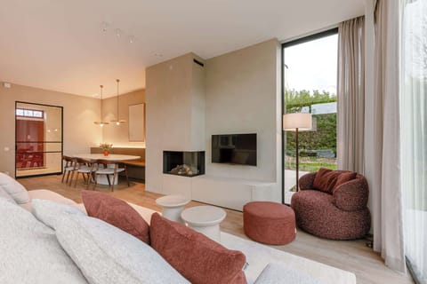 Light-Filled Living Room with Fireplace and Garden Views