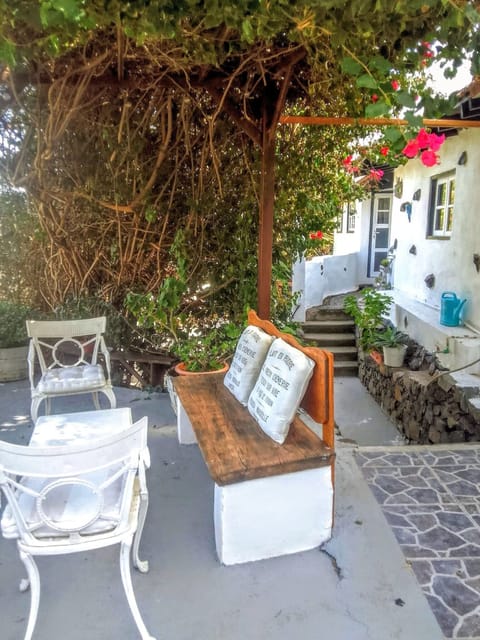 Bougainvillea pergola with seating area. Steps up to Casita Bella Vista 