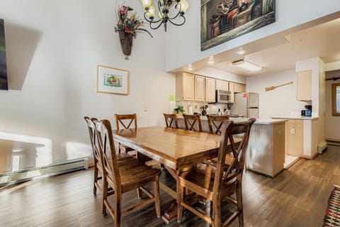 Gather around this elegant dining table where your family meals become cherished memories, with a fully equipped kitchen ready for your culinary adventures.