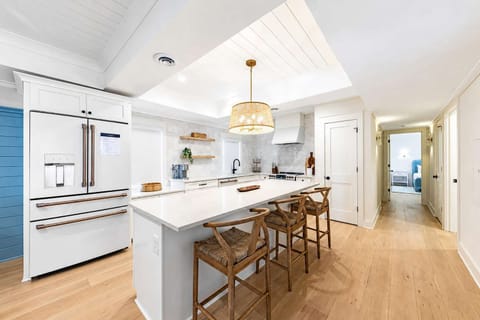 A stunning chef’s kitchen with bright interiors and a spacious island for gathering.