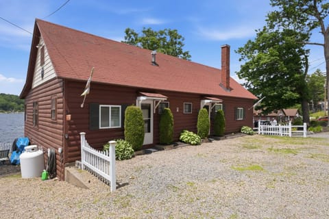 Arrive at a classic lakefront cottage with parking right outside the entrance.