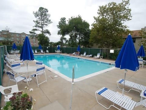 Cool off in the community pool, perfect for sunny afternoons under vibrant blue skies.