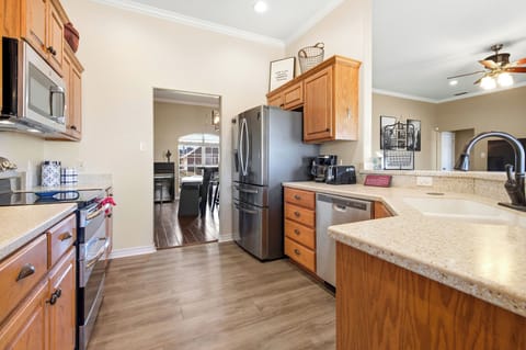 A fully stocked kitchen with appliances is ready for you.