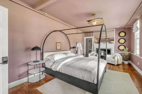 Bedroom #1: Unwind in a plush king bed with a private ensuite bathroom and a cozy sitting area for two, perfect for enjoying your morning coffee or relaxing after a day of exploring.