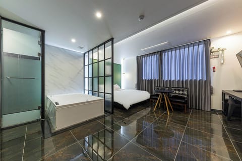 Suite, City View | Desk, laptop workspace, blackout drapes, free WiFi