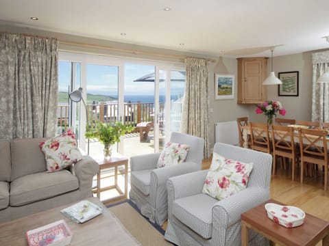 Spacious living area with patio doors to raised terrace | Cedar Lodge, Portpatrick