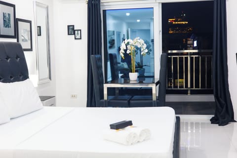 Standard Condo, 1 King Bed, Balcony, City View | In-room safe, free WiFi