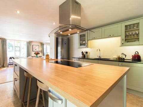 Wonderful bespoke kitchen with wood-topped island | The Dairy House, Illminster