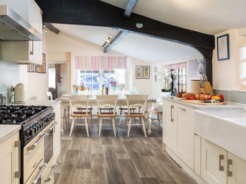 Delightful farmhouse kitchen style dining table and chairs | The Old Sweet Shop - Vicarage Road Holiday Cottages, Minehead