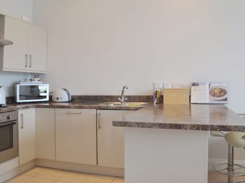 The open plan format allows for a n open, roomy kitchen area | Apartment 8 - Astor House, Torquay