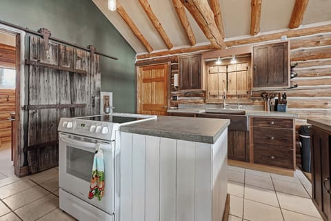 Fully equipped kitchen with cozy cabin feel