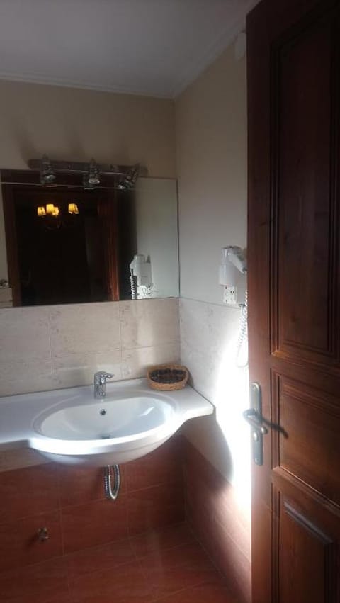 Shower, free toiletries, hair dryer, slippers