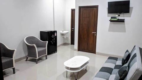 Double Room, Refrigerator | Living area | 24-inch LCD TV with cable channels