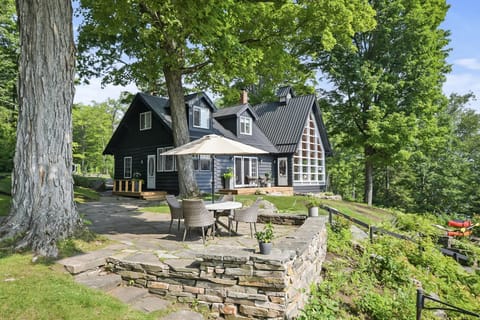 Charming lakeside patio with cozy seating and scenic views