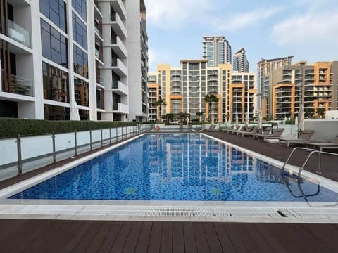 Shared swimming pool with modern surroundings at Azizi Riviera
