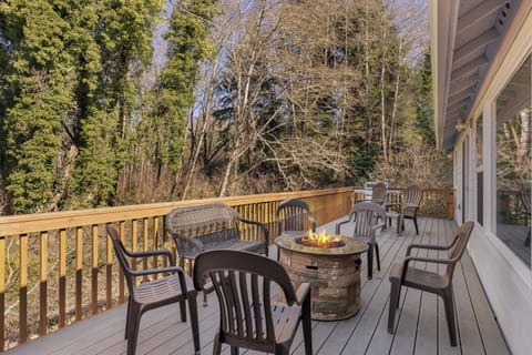 Private deck with fire pit & seating—perfect for relaxing evenings under the coastal sky.