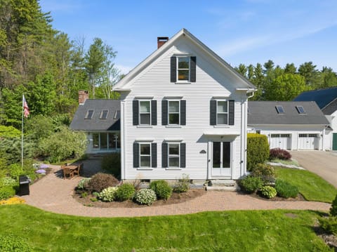 Classic white farmhouse charm meets timeless New England character.