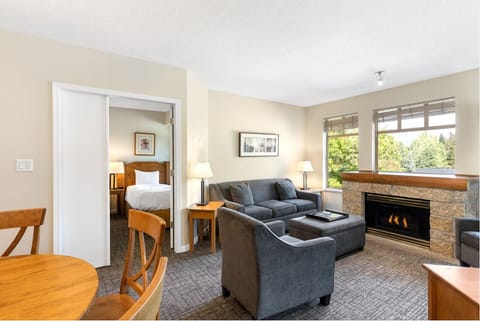 Lounge together in plush seating beside the crackling fireplace.