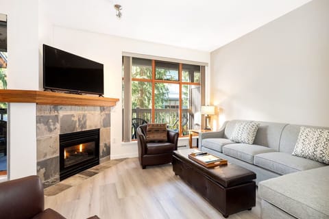 Gather by the glowing fireplace after a day outdoors.