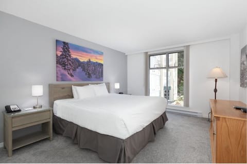 Unwind in crisp linens with soft light and quiet comfort.