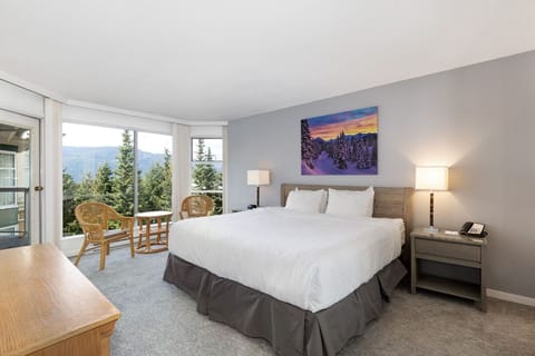 Wake up to serene views from a plush, restful bedroom.