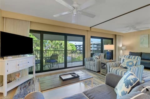 A bright and spacious living area with beautiful balcony views.