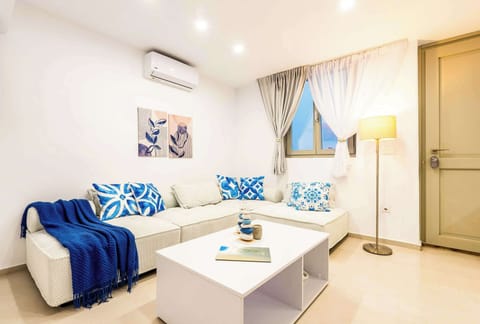 Bright and cozy living area with blue coastal accents
