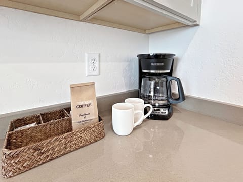 Wake up to the aroma of freshly brewed coffee in your well-equipped kitchen, complete with quality coffee maker and coffee provided for guests.