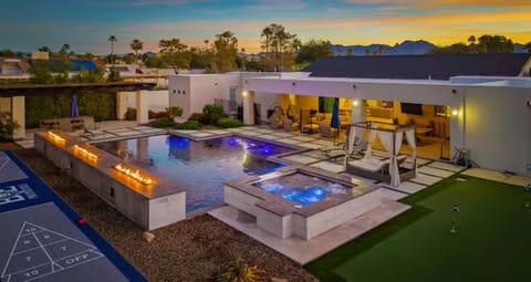 Expansive backyard with pool, spa, bocce, shuffleboard, putting green, and more.