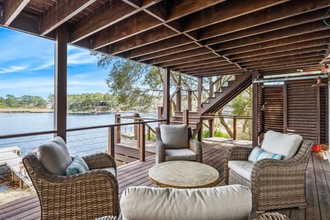 Relax on this private lakefront deck with a dock and kayaks just steps away