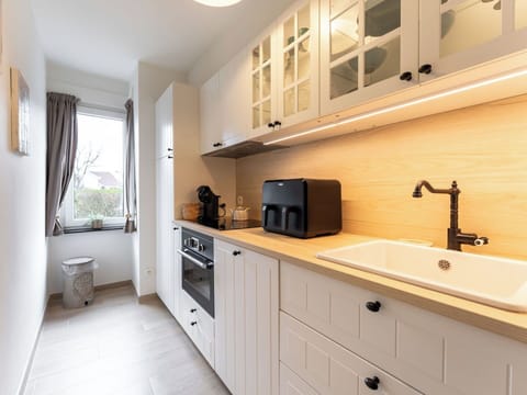 Countertop, Kitchen, Cabinetry, Kitchen Appliance, Furniture, Interior Design, Flooring, Wood, Major Appliance, Drawer