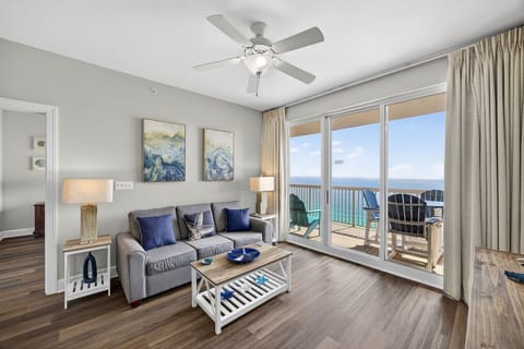 Relax in your beautifully appointed living room with stunning ocean views through floor-to-ceiling windows and your private balcony beckoning.