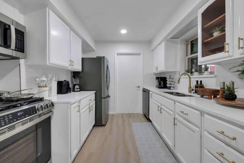 Bright and spacious kitchen with modern finishes and ample counter space for cooking, entertaining, and gathering with friends and family.