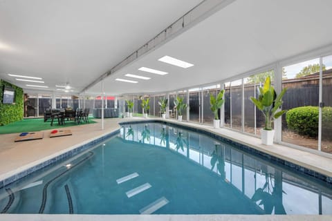 A peaceful view of the indoor pool area where natural light and greenery create a relaxing retreat for guests of all ages.