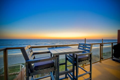 Oceanfront balcony perfect for sunset dining