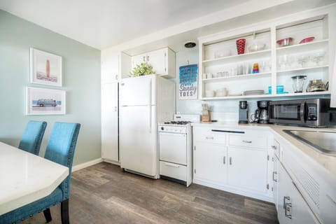 Bright, fully stocked kitchen for beach meals